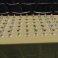 Cups for attendees charged with cognac or water awaiting the call for the toast